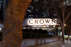 The Crown Resorts logo is displayed at the entrance of the Crown Towers hotel in Melbourne, Australia.