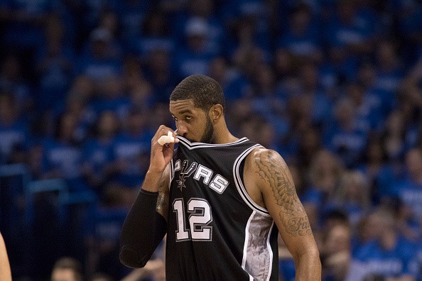 LaMarcus Aldridge pauses as he watches game action against the Oklahoma City Thunder during the second half of Game Six of the Western Conference Semifinals during the 2016 NBA Playoffs.