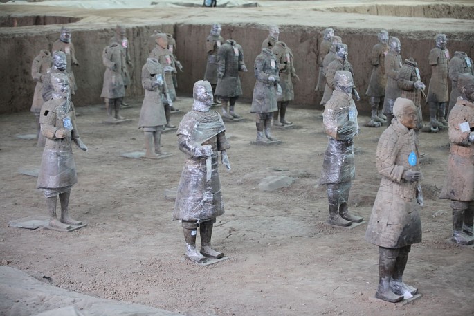 Some of the Terracotta Warriors in Xi'an, Shaanxi Province, are covered with protective plastic as they were being restored.