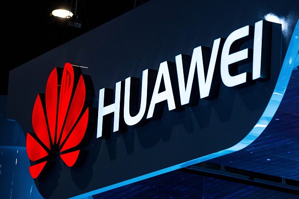 A logo sits illuminated outside the Huawei pavilion during the second day of the Mobile World Congress 2015 at the Fira Gran Via complex on March 3, 2015, in Barcelona, Spain. 