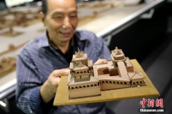 Wang Tailai shows his work in Xi'an, Shaanxi Province, on Oct. 20, 2016. 
