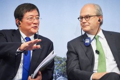 Ren Jianxin, chairman of ChemChina, talks to Michel Demare, chairman of Swiss farm chemicals giant Syngenta, during a press conference at the company's headquarters in Basel, Switzerland.