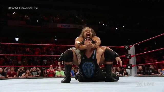 Rusev applies The Accolade submission on Roman Reigns during their match on Monday Night Raw.