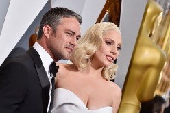 Recording artist Lady Gaga (R) and actor Taylor Kinney attend the 88th Annual Academy Awards at Hollywood & Highland Center on February 28, 2016 in Hollywood, California.