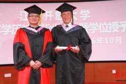 A picture of pride and humility as 88-year-old Zhang (right) poses for a graduation photo.