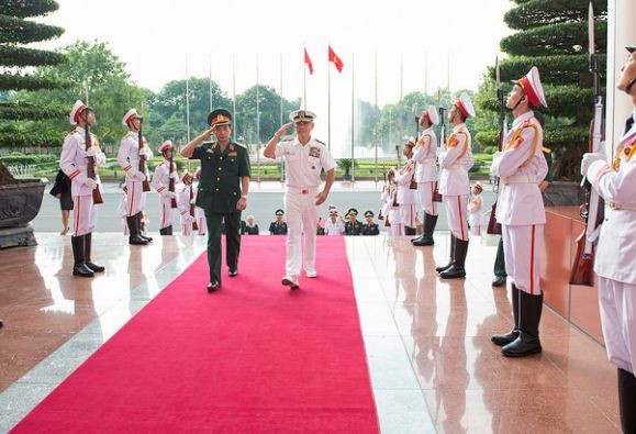 Lt. Gen. Phan Van Giang and Adm. Harry Harris Jr., commander of U.S. Pacific Command, during an honor ceremony at Vietnam's Ministry of National Defense.