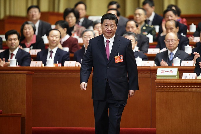 Xi Jinping attends the closing session of the National People’s Congress at the Great Hall of the People in Beijing on March 17, 2013 as newly elected president.