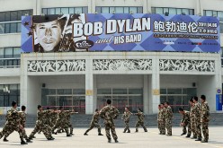 Chinese security personnel conduct drills outside the venue for U.S. music legend Bob Dylan's first concert in China in April 2011 in Beijing.