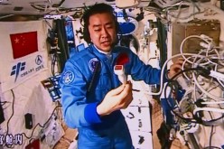Chen Dong, one of the two astronauts in the Tiangong-II, introduces the equipment used for the in-orbit ultrasonic inspection to test their cardio-pulmonary function, on Oct. 30, 2016.