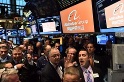 Traders at the New York Stock Exchange wait for Alibaba's stock to go live during its opening in 2014.