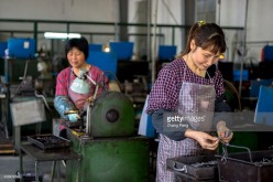 Workers prepare materials in a manufacturing company in Nantong.