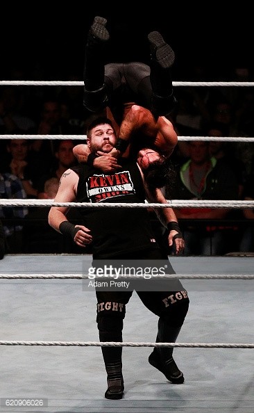 Kevin Owens and Seth Rollins doing battle at a house show