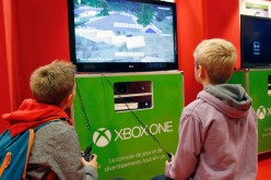 Children play the video game 'Minecraft' on Microsoft Xbox One console during the 'Paris Games Week'on October 27, 2016 in Paris, France. 'Paris Games Week' is an international trade fair for video games to be held from October 27 to October 31, 2016.