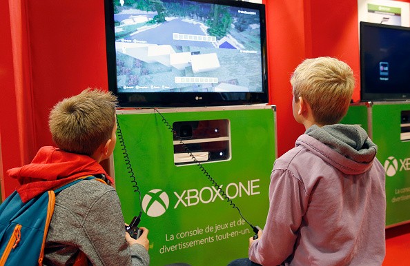 Children play the video game 'Minecraft' on Microsoft Xbox One console during the 'Paris Games Week'on October 27, 2016 in Paris, France. 'Paris Games Week' is an international trade fair for video games to be held from October 27 to October 31, 2016.