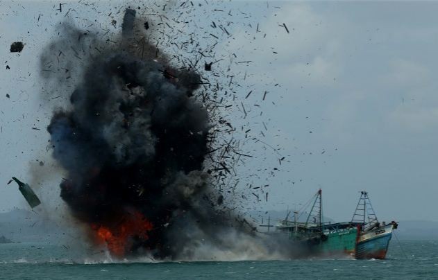Indonesian Navy blows up foreign fishing boats caught illegally fishing in its waters in 2016.    