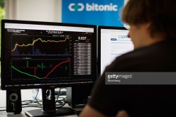 An employee of a Dutch financial company monitors the bitcoin exchange rate on his computer. 