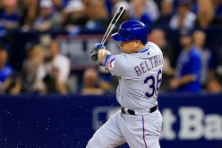 Carlos Beltran of the Texas Rangers hits an RBI against the Toronto Blue Jays in the first inning during Game Three of the  2016 ALDS.