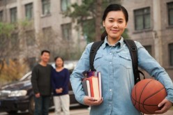 Books, ball and a belle: Chinese students studying abroad impressed the school of their choice either by their grades or background in sports--sometimes even by both.