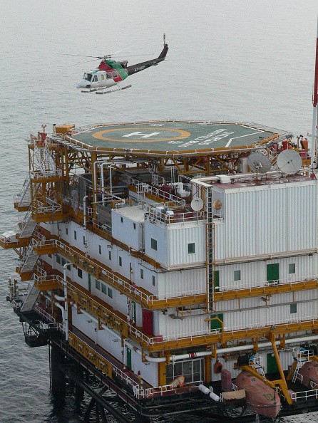 A helicopter lands in an oil rig operated by a Qatar company in the Persian Gulf.