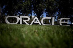 The Oracle logo is displayed in front of the Oracle headquarters on June 19, 2014, in Redwood Shores, California.