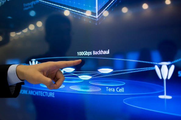 An employee of Huawei Technologies Co. explains how a network connection works in its industrial campus in Shenzhen.