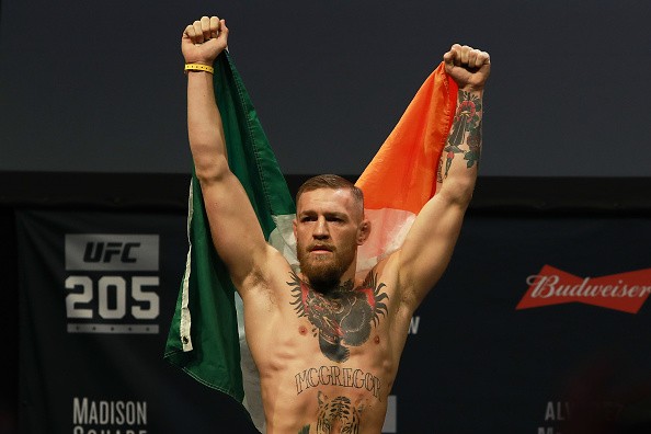 Conor McGregor reacts as he walks on stage for UFC 205 Weigh-ins at Madison Square Garden on November 11, 2016 in New York City.