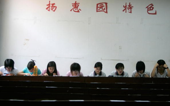 Chinese students take the English test, part of the National College Entrance Examination, at the University of International Business and Economics. 