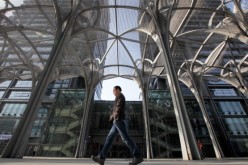 A man walks past the office buildings at the Tsinghua University Science Park (Tuspark) in the Shangdi area of Beijing.