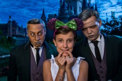  'Stranger Things' star Millie Bobby Brown, known as 'Eleven,' a girl with super powers against evil forces, poses with two 'grave diggers' at Magic Kingdom Park October 12, 2016 in Lake Buena Vista, Florida. Brown is currently vacationing with her family