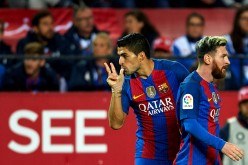 Barcelona players Luis Suárez (L) and Lionel Messi.