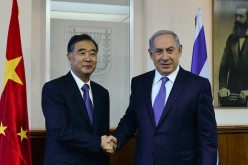 Chinese Vice Premier Wang Yang shakes hands with Israel Prime Minister Benjamin Netanyahu during their meeting in West Jerusalem in November last year.