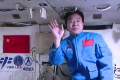 Greetings from outer space: Chinese astronaut Jing Haipeng waves as he records a video of himself delivering a message while inside the Chinese space laboratory Tiangong-2 in Oct. 2016.