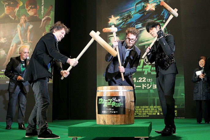 Director Michel Gondry (2nd L), actor and producer Seth Rogen (C) and actor Jay Chou (2nd R) pound rice cake during the Japan Premiere of 'The Green Hornet.'