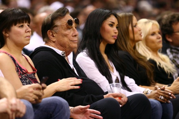 Former Los Angeles Clippers owner Donald Sterling and V. Stiviano watch the San Antonio Spurs play against the Memphis Grizzlies back in 2013.