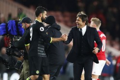 Chelsea striker Diego Costa (L) celebrates with head coach Antonio Conte.
