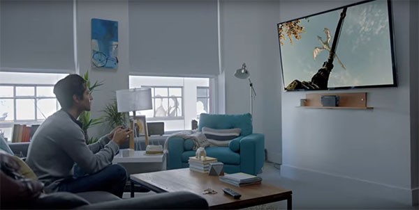 A man plays with a video game on the latest Nintendo Switch.