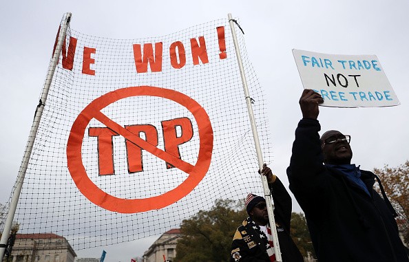 Americans march to hold a protest against the Trans-Pacific Partnership (TPP) deal in Washington, D.C. 