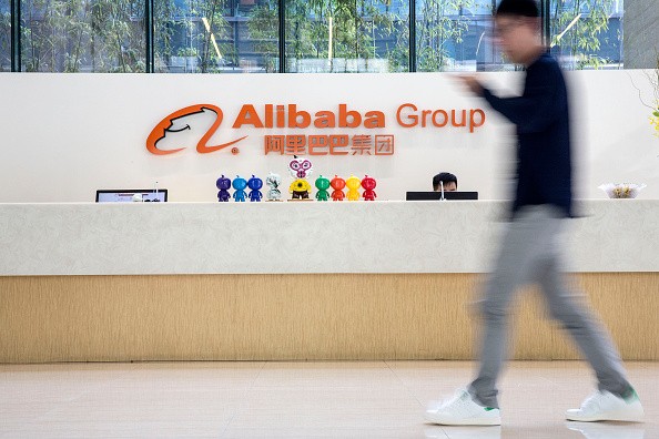 An employee walks past the reception counter at Alibaba headquarters in Hangzhou.