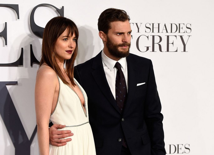 Dakota Johnson and Jamie Dornan attend the UK Premiere of 'Fifty Shades Of Grey' at Odeon Leicester Square on February 12, 2015 in London, England.