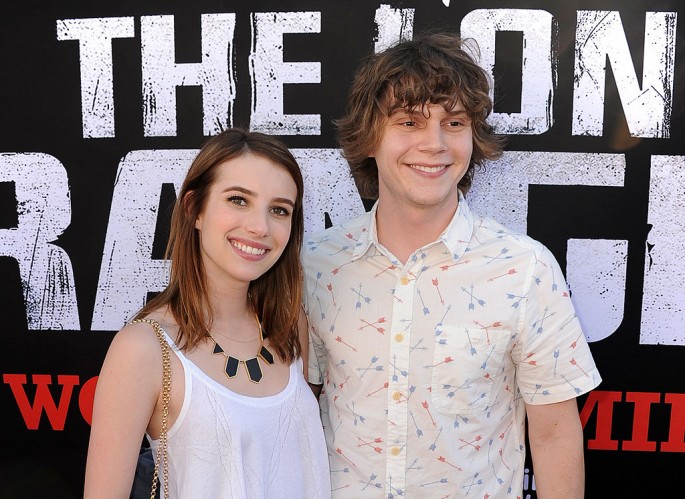 Actors Emma Roberts (L) and Evan Peters arrive at the premiere of Walt Disney Pictures' 'The Lone Ranger' at Disney California Adventure Park on June 22, 2013 in Anaheim, California.