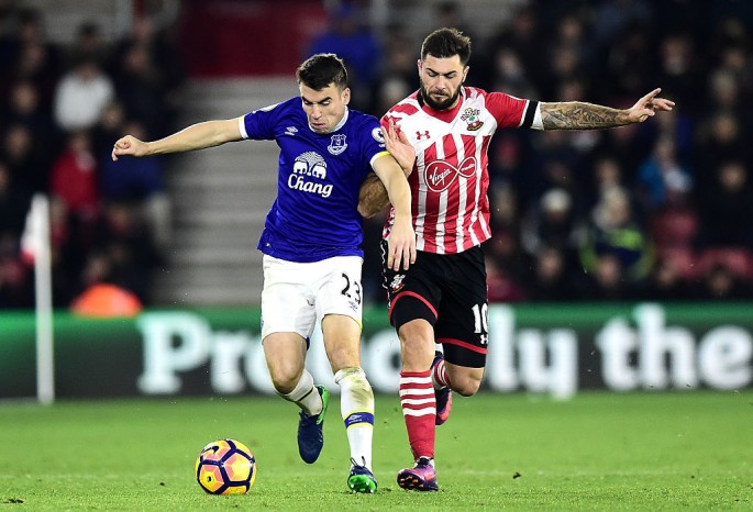 Southampton forward Charlie Austin (R) competes for the ball against Everton's Seamus Coleman.