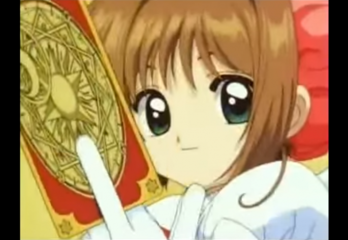 A screenshot of Sakura Kinimoto with one of the Claw cards in her hand. 