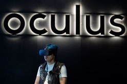 A gamer uses an Oculus Rift headset in the Oculus booth during the annual E3 2016 gaming conference at the Los Angeles Convention Center on June 14, 2016 in Los Angeles, California.