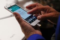 A person tries a new Google Pixel phone at the Google pop-up shop in the SoHo neighborhood on Oct. 20, 2016 in New York City. 