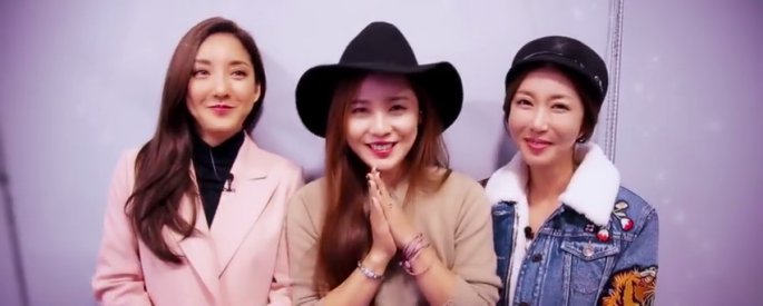 (L-R) S.E.S. members Sea or Bada, Eugene and Shoo greet their fans in a video clip.