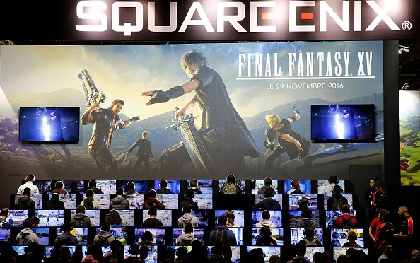 amers play the video game 'Final Fantasy XV' developed and published by Square Enix during the 'Paris Games Week'.