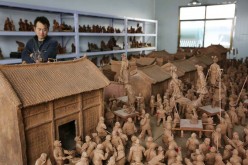 Miao Chunsheng's house is filled with clay sculptures. 