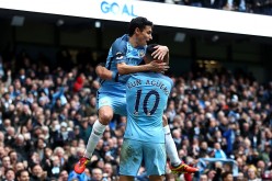 Manchester City players Jesus Navas and Sergio Agüero (#10).