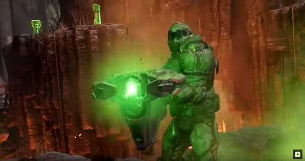 A "Doom" marine player fires his plasma gun against an opponent.
