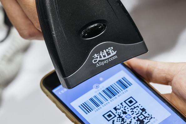 An Alipay user pays through a bar code scanned from his mobile phone. 